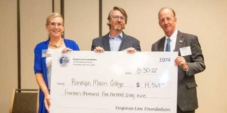 Rich Meagher stands with representatives of the Virginia Law Foundation holding a check for $14,569 made out to Randolph-Macon College