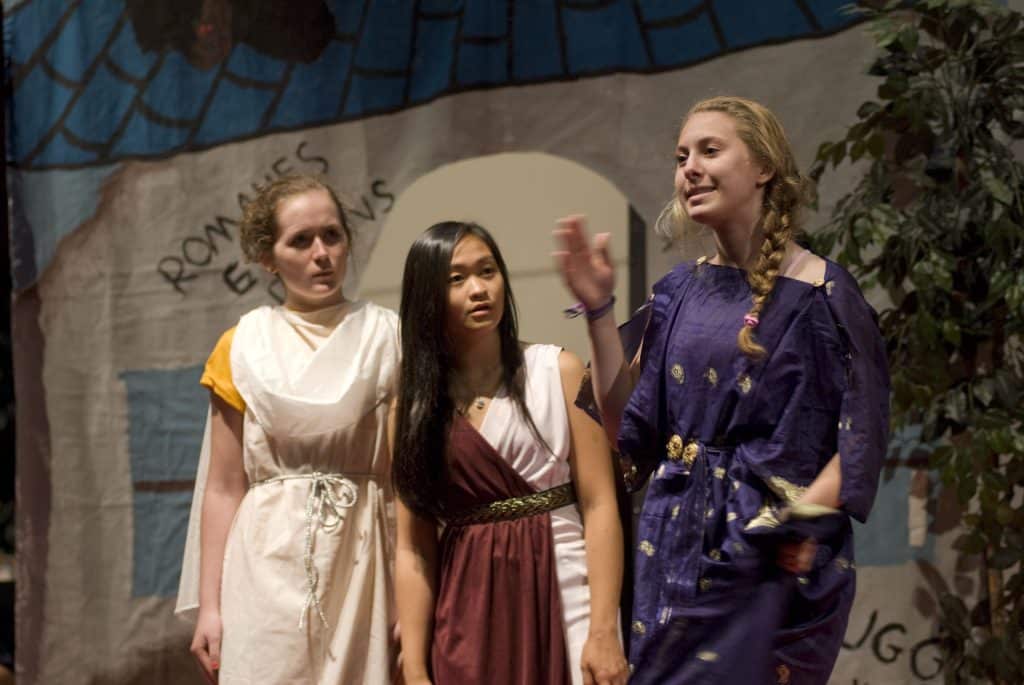 Latin Academy students performing in play in costume