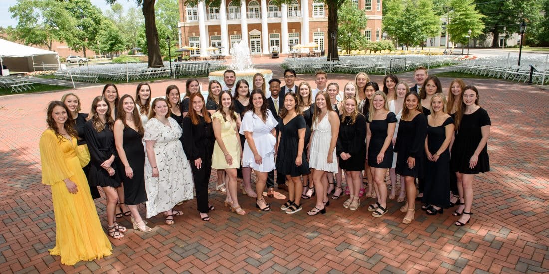 The inaugural class of RMC nursing graduates in front of the fountain