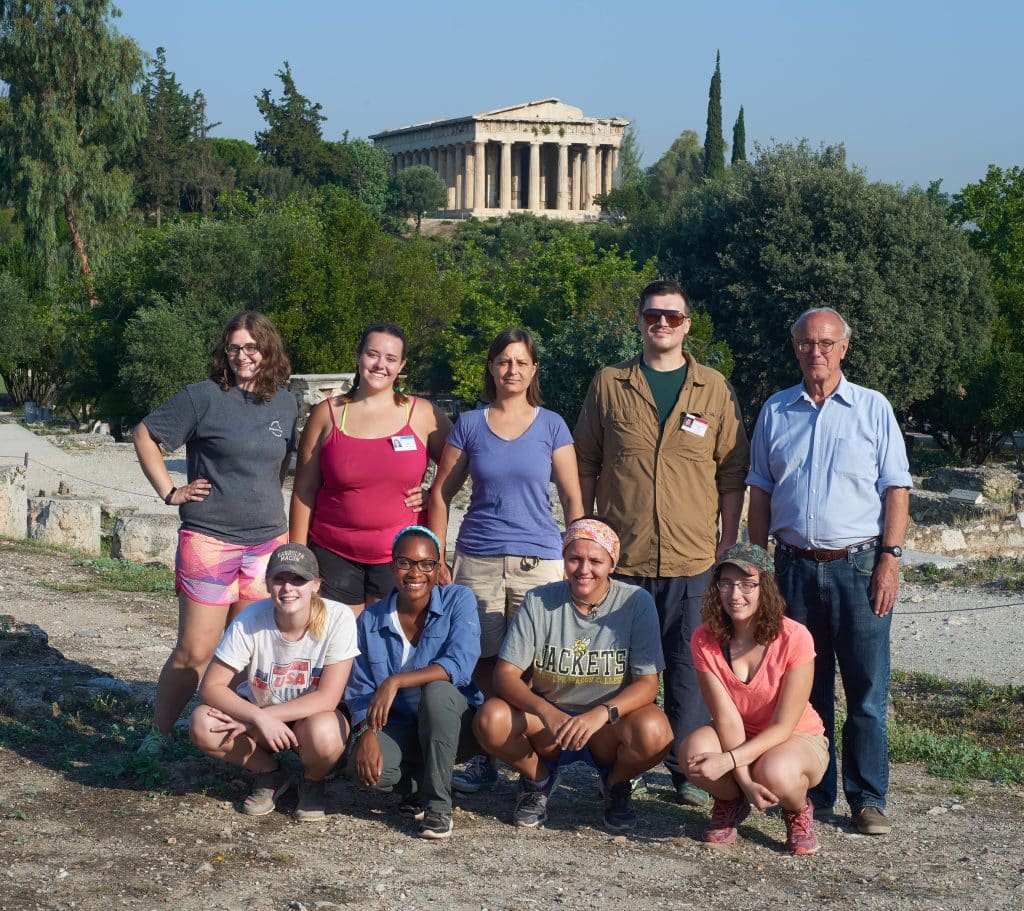 Group of students and faculty with Acropolis in the background