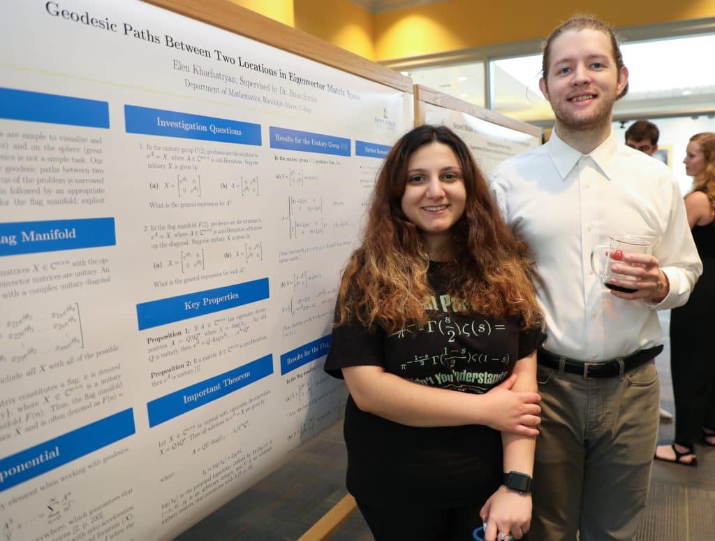 Elen Khachatryan standing in front of a research poster