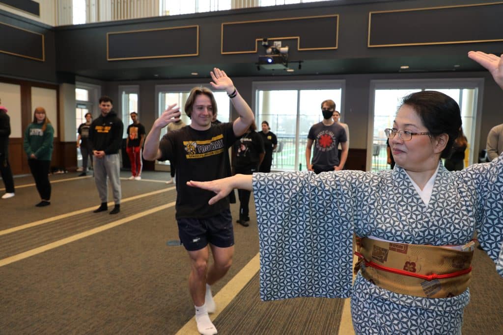 RMC students learning traditional Japanese dancing