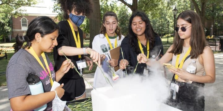 Pathways to Science participant work with liquid nitrogen with Professor Rebecca Michelsen
