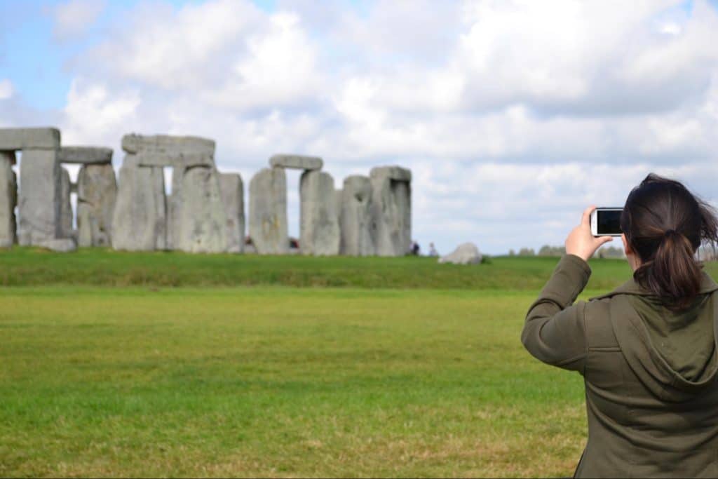 Student taking a photo of Stonehenge
