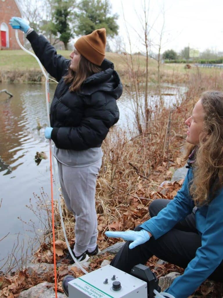 Two students conducting biological field research