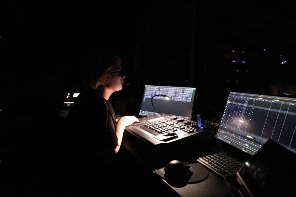 Theatre student running the lights and sound during a production