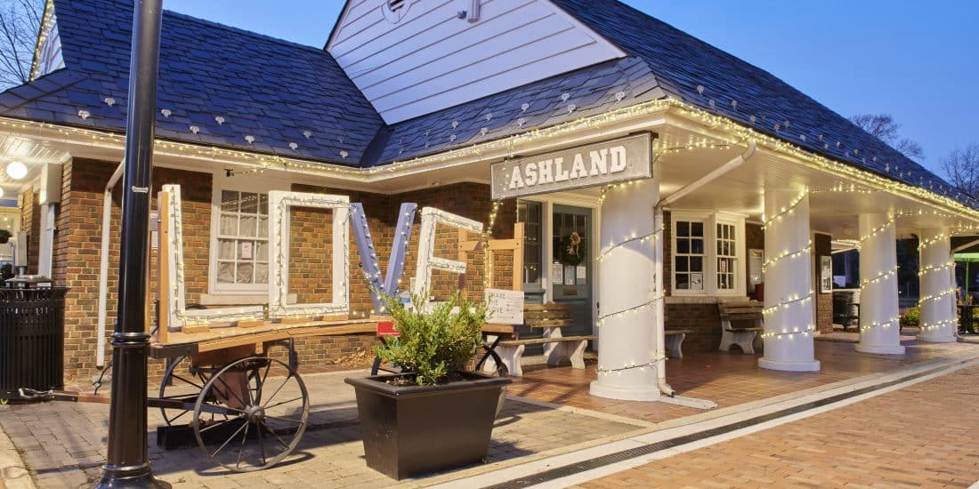 A photo of the ashland train station with a Love sign on a wagon