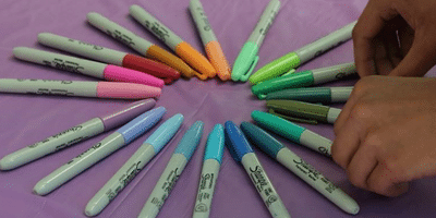 Sharpie pens displayed in Pride Colors