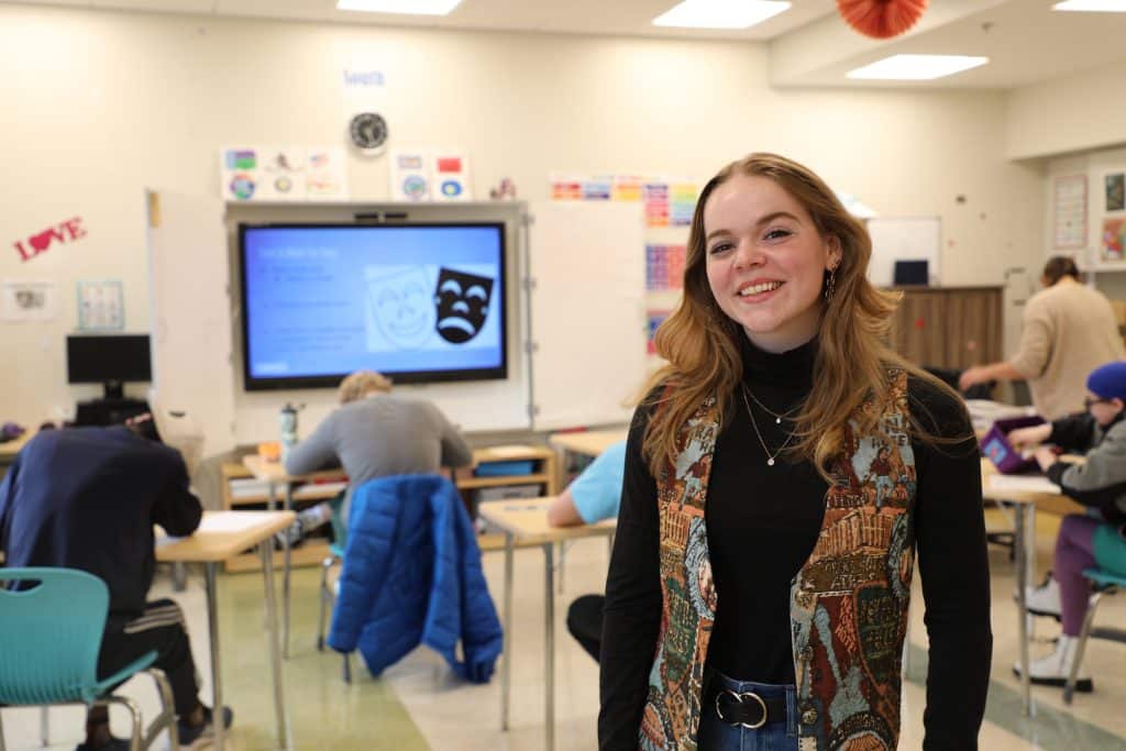 Chelsea Shaul ’24 stands in front of the Faison Center classroom where she spent a January Term giving instruction to students with autism and related challenges.