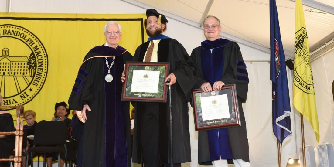 Professor Sheckels and Professor Jefferson standing with president Lindgren holding their awards