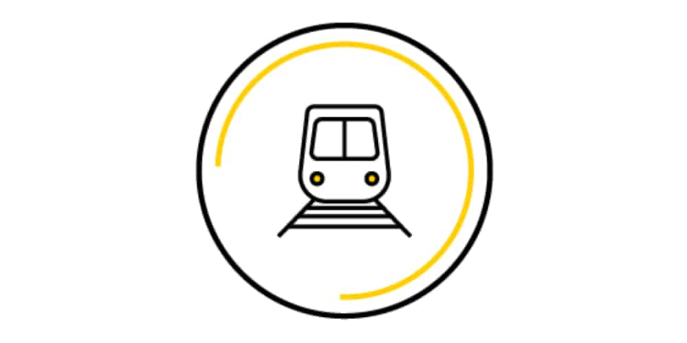 A train icon in a yellow circle on a white background.