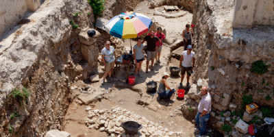 John Camp oversees an archaeology dig site in Greece with Randolph-Macon students