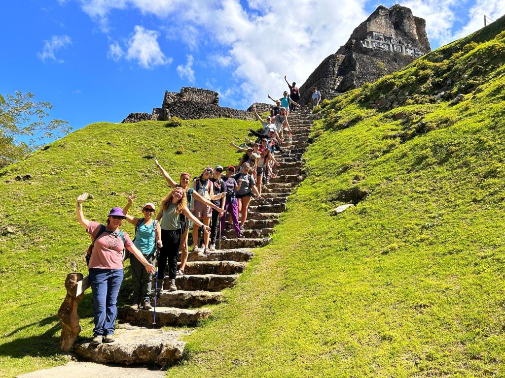 RMC biology students lined up on the stairs of ruins during a J-Term travel course in Belize