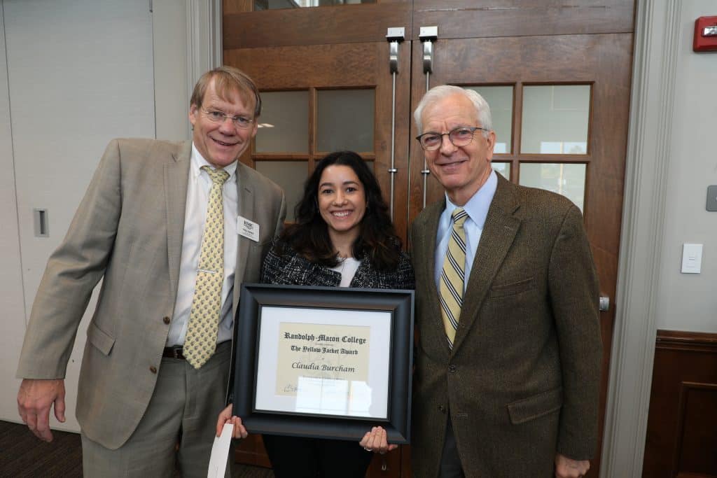 Claudia Burcham poses with Paul Davies and President Lindgren at the Fall 2023 Yellow Jacket Awards