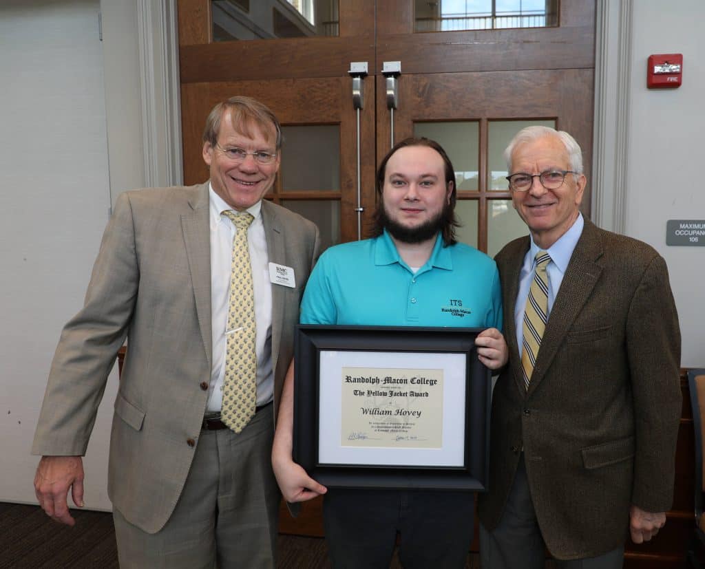 William Hovey '21 poses with Paul Davies and President Lindgren at the Fall 2023 Yellow Jacket Awards
